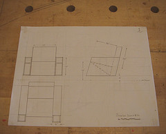 Scale drawing of an angled art deco inspired chair with side book storage